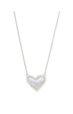 Feminine and classic with an asymmetrical design, the Ari Heart Pendant Necklace is our new obsession. Layer it or let it shine on its own - either way you'll be hearing 'Where'd you get that?' every time you wear this pendant necklace out. Dimensions 0.49' L x 0.57' W pendant on 15'L chain + 2' extender Pearl Heart Necklace, Jewelry Wishlist, Short Pendant Necklace, New Obsession, Let It Shine, Fame Dr, Birthday List, Silver Heart Necklace, Jewelry Lookbook