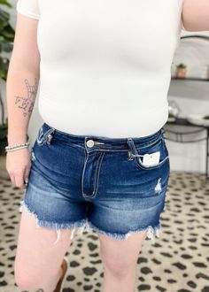 These destructed denim shorts are the perfect blend of edgy style and everyday comfort. Crafted from premium denim, these high-rise shorts are designed to accentuate your silhouette while providing a comfortable fit, thanks to the stretch fabric that moves with you. The raw hem adds a touch of rebellious charm, making these shorts a standout piece in any wardrobe. Edgy Style, High Rise Shorts, Premium Denim, Dark Denim, Edgy Fashion, Stretch Fabric