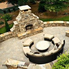 an outdoor seating area with fire pit and patio furniture