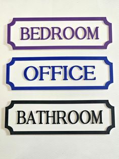 three signs that say bathroom, bedroom and office