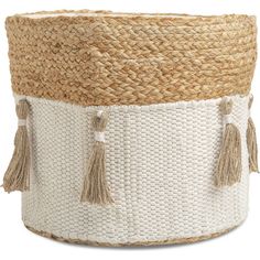 a white and tan basket with tassels