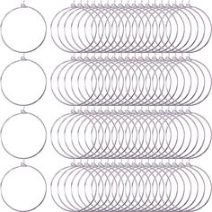 a bunch of silver colored metal rings on a white background