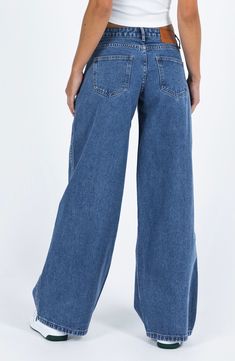 Flaunt vintage vibes in these medium-wash nonstretch jeans featuring a low-rise waist and full-length wide legs. 31 1/2" inseam; 26" leg opening; 10 1/2" front rise; 14" back rise (size 8) Zip fly with button closure Five-pocket style 70% cotton, 15% viscose, 15% polyester Machine wash, line dry Imported Wide Jeans Outfit High Waist, Medium Wash Jeans Outfit, Low Rise Wide Leg Jeans, Ultra Low Rise Jeans, Womens Low Rise Jeans, Teen Jeans, School Clothing, High School Outfits, Jeans Hollister