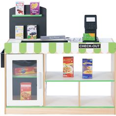 a checkout counter with food on it and a phone sitting on top of it