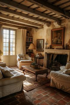 a living room with two couches and a fire place in the middle of it