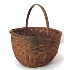 a brown wicker basket on a white background