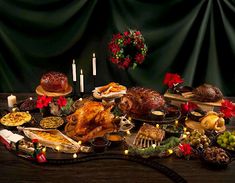 a table topped with lots of food and candles