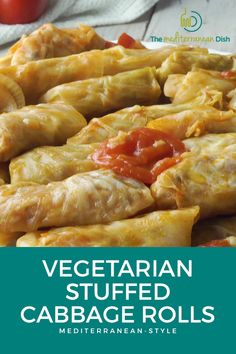 vegetarian stuffed cabbage rolls with tomatoes on the side and text overlay that reads vegetarian stuffed cabbage rolls mediterranean style