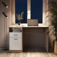 a desk with a laptop on it in front of a window and potted plant