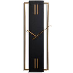 a large black and gold clock on a white wall with two hands in the shape of a rectangle