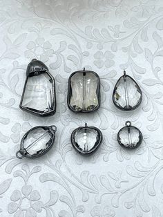 Crystal Gunmetal Soldered Pendants and charms. Connector Soldered Charm, 6 Styles of Charms and Pendants, Clear Crystal. Fast Shipping 6 Shapes/ styles (Choose from menu) Size: Style #1: 44.7mm x 23.8mm Style #2: 32.2mm x 21.7mm Style #3: 28.5mm x 19mm Style #4: 30.3mm x 18.7mm Style #5: 22mm x 20mm Style #6: 18.5mm x 15.7mm Gunmetal Components used in finished pieces are not included but can be purchased in my shop. For ideas only. www.instagram.com/blingbya @blingbya Soldering Projects, Clear Crystal Necklace, Soldered Pendants, Cheese Danish, Stained Glass Jewelry, Clear Crystals, Crystal Necklace Pendant, Shipping Orders, Coin Pendant