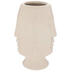 a white vase with a face on it