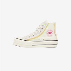 white converse high top sneakers with stars on the side