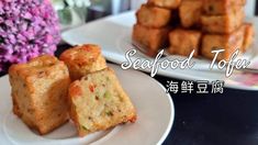 there are two plates with food on them and the words seafood tofu written in chinese