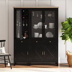 a black china cabinet with glass doors in a living room next to a potted plant