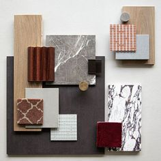 an assortment of tile and wood pieces arranged on top of each other in different colors