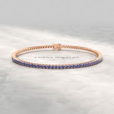 Elevate your style with this exquisite 3.14-carat natural blue sapphire tennis bracelet, meticulously crafted in lustrous 14K/18K yellow gold. Each shimmering sapphire is artfully set, creating a mesmerizing ombre effect that transitions seamlessly from lighter to darker hues. Perfect for celebrating September birthdays, this bracelet makes a timeless Birthday gift. Its timeless design and exceptional craftsmanship ensure it will become a cherished heirloom for generations to come. 𝐅𝐞𝐚𝐭𝐮𝐫? Classic Blue Round Tennis Bracelet, Classic Sapphire Tennis Bracelet With Round Shape, Blue Sapphire Round Bracelet, Gold Sapphire Tennis Bracelet, Gold Sapphire Round Bracelets, Sapphire Tennis Bracelet, Stacked Wedding Rings, Engagement Rings Oval, Natural Blue Sapphire