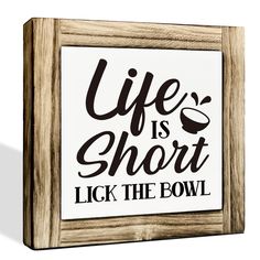 a wooden frame with the words life is short, lick the bowl