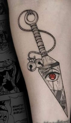 a tattoo on the leg of a person with a knife and eyeball in it