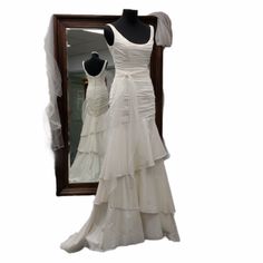 a dress is displayed in front of a mirror