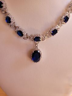 Created sapphire and diamond necklace and earring set.  Sapphire chain is 18 inches non adjustable and comes with a one inch extender.  Sapphires are 3mm oval and center stone is 7mm oval.  Diamond accents.  Earrings are two inches with a 1.75 inch drop.  7mm oval center stone.  Set in stamped 925 silver. Ruby And Sapphire Jewelry, Blue Sapphire Necklace Gold, Sapphire Necklace Vintage, Sapphire And Diamond Necklace, Lengha Jewellery, Sapphire And Pearl Necklace, Sapphire Jewelry Necklace, Victorian Jewelry Necklace, Sapphire Necklace Gold