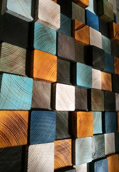 wood wall art made with different colors and shapes