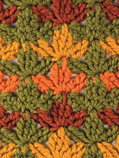 the crochet pattern is made up of many different colored yarns and leaves