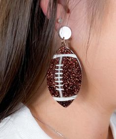 Introducing our "Fantasy Football Glitter Earrings," the perfect accessory for game day enthusiasts and football fanatics. These dazzling earrings feature glittery football shapes that add a touch of sparkle to any outfit. Measuring 2.5 inches in length and designed with a secure post back, these earrings ensure a comfortable fit while making a bold statement.
Ideal for game days, Friday night lights, tailgating parties, or any football-related event, the "Fantasy Football Glitter Earrings" are sure to turn heads and showcase your passion for the sport. Whether you're cheering from the stands, hosting a game day party, or enjoying a casual day out, these earrings add a fun and festive flair to your look.
Crafted with high-quality materials, these earrings are lightweight and durable, perfe Football Earrings, Dazzling Earrings, Black Friday Christmas, Friday Night Lights, Glitter Earrings, Tailgate Party, Fantasy Football, Night Lights, Girly Girl