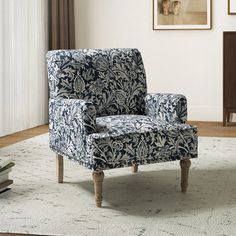 a blue and white chair sitting on top of a rug