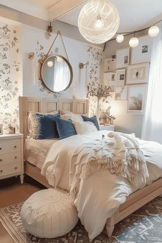 a bedroom with a bed, dressers and pictures on the wall above it is decorated in blue and white