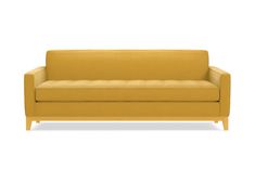 a yellow couch sitting on top of a white floor