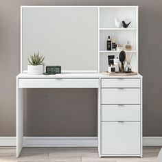 a white desk with two drawers and a mirror