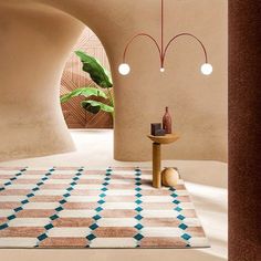 a room with a rug, table and vases on the floor in front of an archway