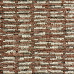 a brown and white rug with vertical stripes