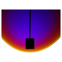 a square object is hanging from a pole in front of a purple and orange background