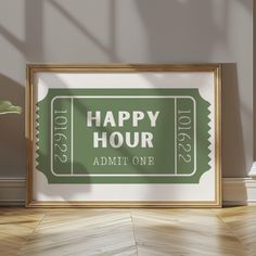 a green happy hour ticket sitting on top of a wooden floor next to a potted plant