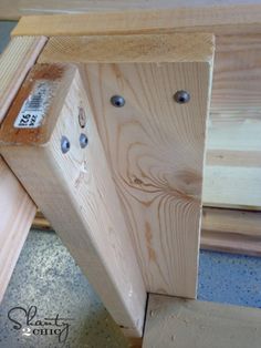 a piece of wood that has been made into a bench with holes in the top