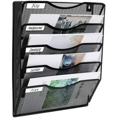 a black mesh magazine holder with five pockets and four file folders on the front