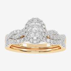 two tone gold wedding ring set with diamonds on each band and an oval shaped diamond in the center