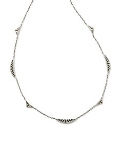 Wanting to add some unique dimension to your necklace stack? Look no further than the Sophee Strand Necklace in Oxidized Sterling Silver. Crafted in long-lasting metal, this strand features rounded and triangular ridges with a hoofprint design, a signature brand detail. Instantly eye-catching, this necklace will add a fun spin to your everyday layers. This necklace is a part of Yellow Rose by Kendra Scott—a brand that celebrates ranch life with Kendra Scott staples alongside select curated jewelry pieces and accessories. Metal Oxidized Sterling Silver Why Sterling Silver? Our Sterling Silver collection features elevated styles to wear time and time again. With a base of both pure silver and copper, Sterling Silver provides a precious yet affordable option that offers long-lasting wear and Layered Silver Necklaces, Silver Kendra Scott, Hoof Print, Necklace Stack, Stacked Necklaces, Silver Collection, Ranch Life, American Southwest, Demi Fine Jewelry