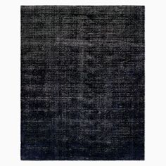 an area rug with black and grey colors