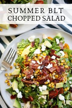 a salad with bacon, avocado and corn is on a white plate next to a fork