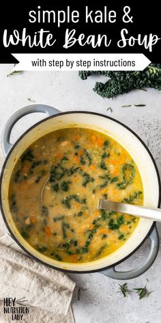 a white bean soup with spinach and carrots in a pot on a table