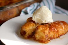 a white plate topped with croissants and ice cream on top of it