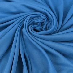 a close up shot of a blue fabric