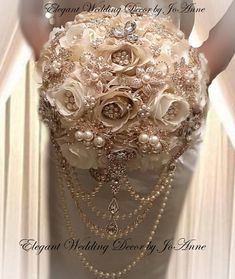 the bridal bouquet is adorned with pearls and flowers