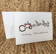 a christmas card with a tractor drawn on it