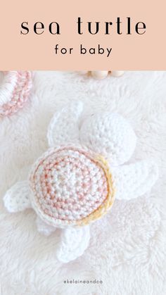 a crocheted turtle is laying on top of a blanket with the words sea turtle for