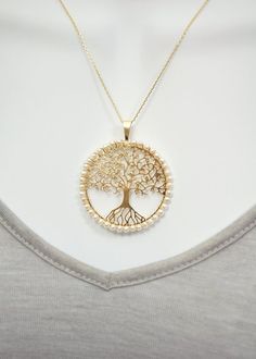 This tree of life pendant is about 1.5 inch in diameter. The pendant features tiny freshwater pearls hand wired onto a gold filled tree. The necklace is a 16" or 18" Italian made gold plated sterling silver chain. Please select the length of chain you would like. Tree Of Life Necklace, Tree Of Life Pendant, Sterling Silver Chain, Gold Gold, Gold Plated Sterling Silver, Tree Of Life, Sterling Silver Chains, Fresh Water, Freshwater Pearls