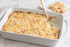 a casserole dish with cheese and meat in it